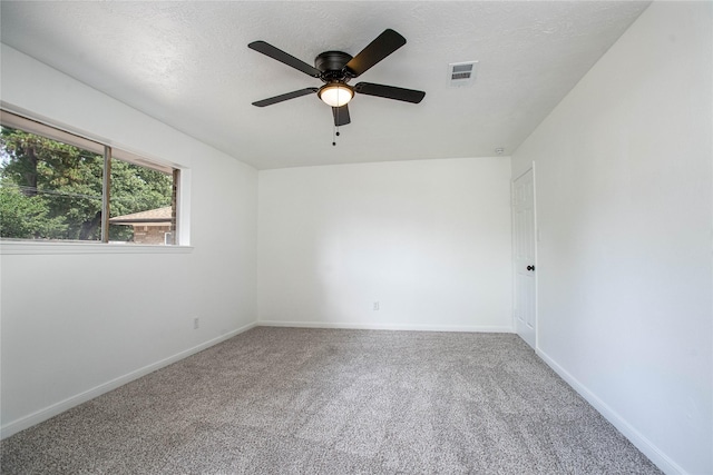 29302 Raestone St, Spring, TX 77386 - empty room featuring carpet floors, a ceiling fan, baseboards, and a textured ceiling