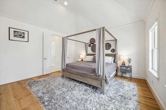 6110 Nicholas Grove Pl, Houston, TX 77055 - bedroom with wood finished floors, baseboards, crown molding, and high vaulted ceiling