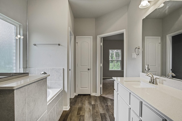 1290 Rd 66112, Dayton, TX 77535 - full bath with vanity, a garden tub, and wood finished floors