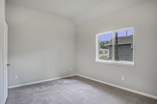 1290 Rd 66112, Dayton, TX 77535 - carpeted empty room with baseboards and vaulted ceiling