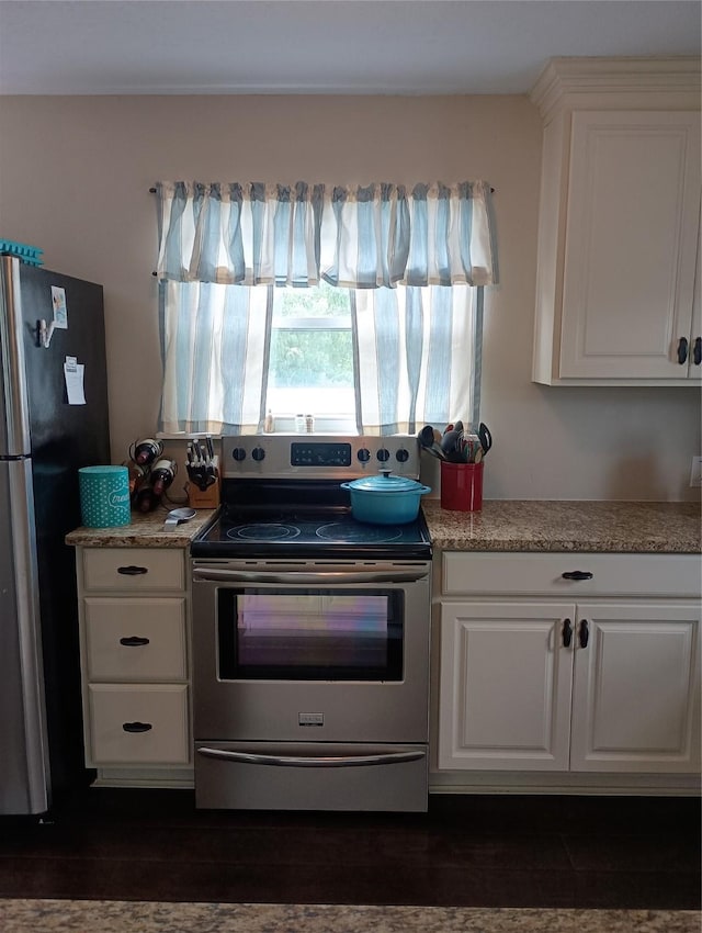 41 Lakeview Shores Dr, Coldspring, TX 77331 - kitchen featuring stainless steel appliances, white cabinets, and light countertops