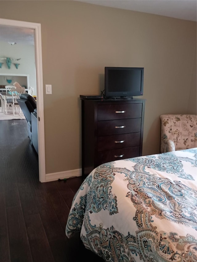 41 Lakeview Shores Dr, Coldspring, TX 77331 - bedroom featuring baseboards and dark wood finished floors