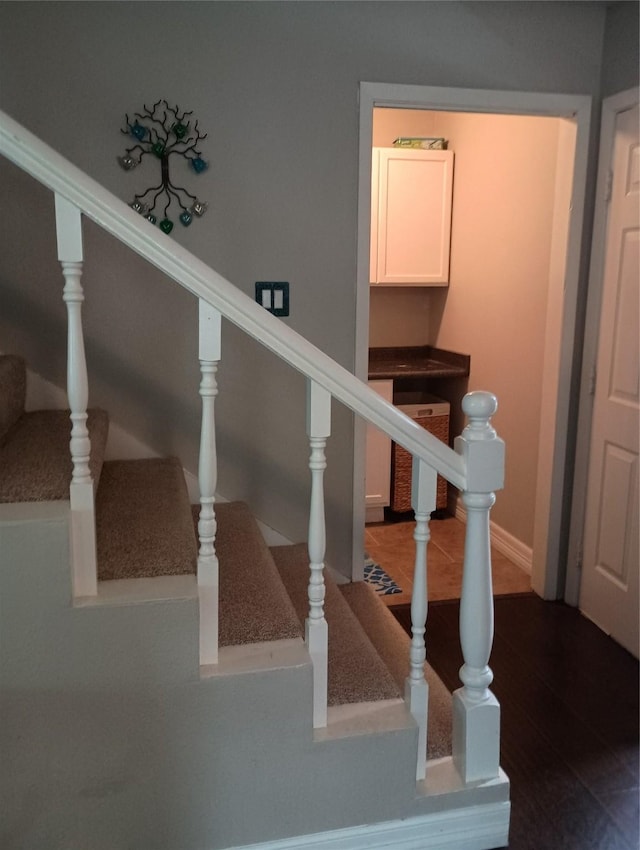 41 Lakeview Shores Dr, Coldspring, TX 77331 - stairway with baseboards and wood finished floors