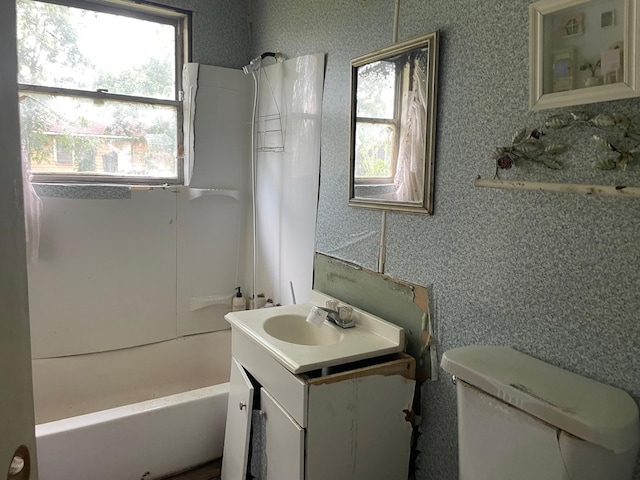 3706 Yosemite St, Houston, TX 77021 - bathroom featuring vanity, plenty of natural light, shower / bathtub combination, and toilet