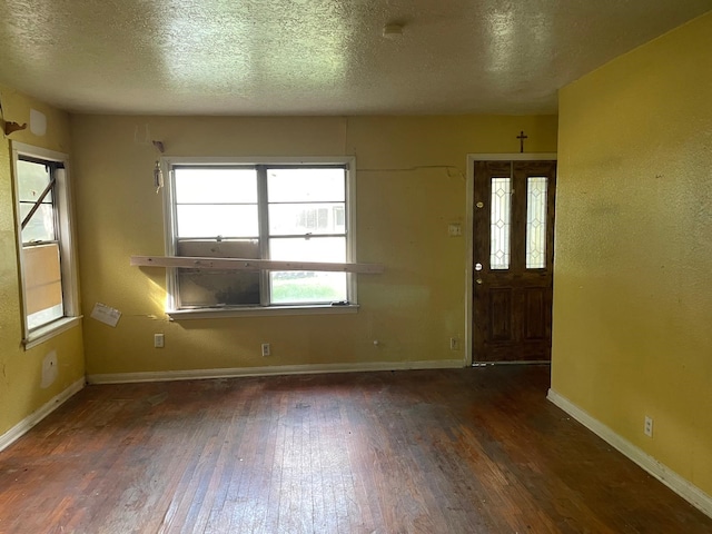 3706 Yosemite St, Houston, TX 77021 - entrance foyer featuring hardwood / wood-style flooring, baseboards, and a textured ceiling