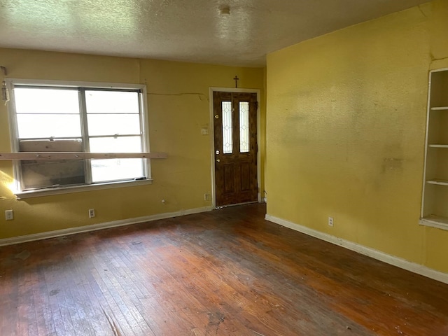 3706 Yosemite St, Houston, TX 77021 - entrance foyer featuring hardwood / wood-style floors, healthy amount of natural light, baseboards, and a textured ceiling