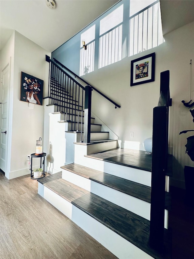 210 E 39th St, Houston, TX 77018 - staircase featuring wood finished floors and baseboards