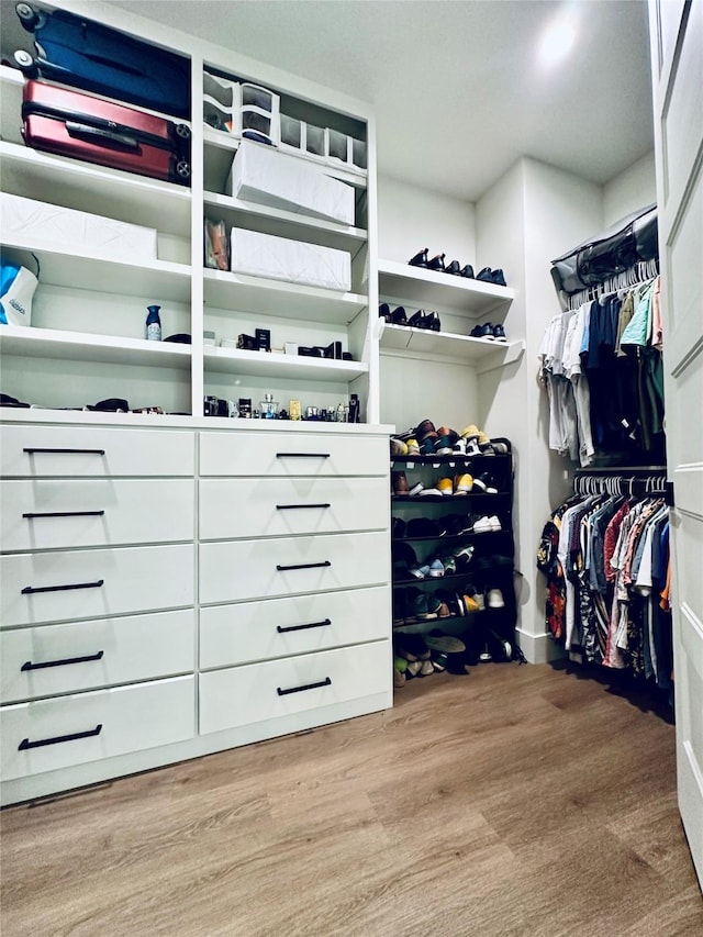 210 E 39th St, Houston, TX 77018 - walk in closet featuring wood finished floors