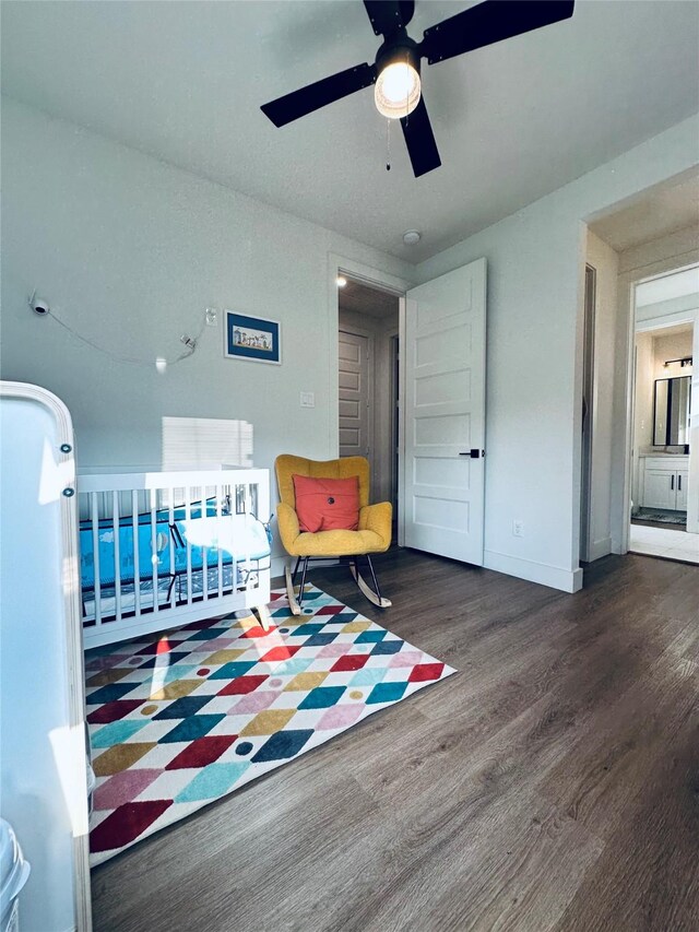210 E 39th St, Houston, TX 77018 - bedroom featuring wood finished floors, a ceiling fan, and baseboards