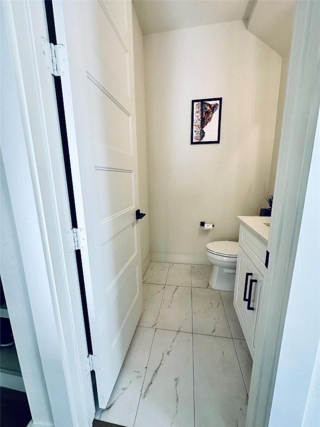 210 E 39th St, Houston, TX 77018 - bathroom featuring marble finish floors, toilet, vanity, and baseboards