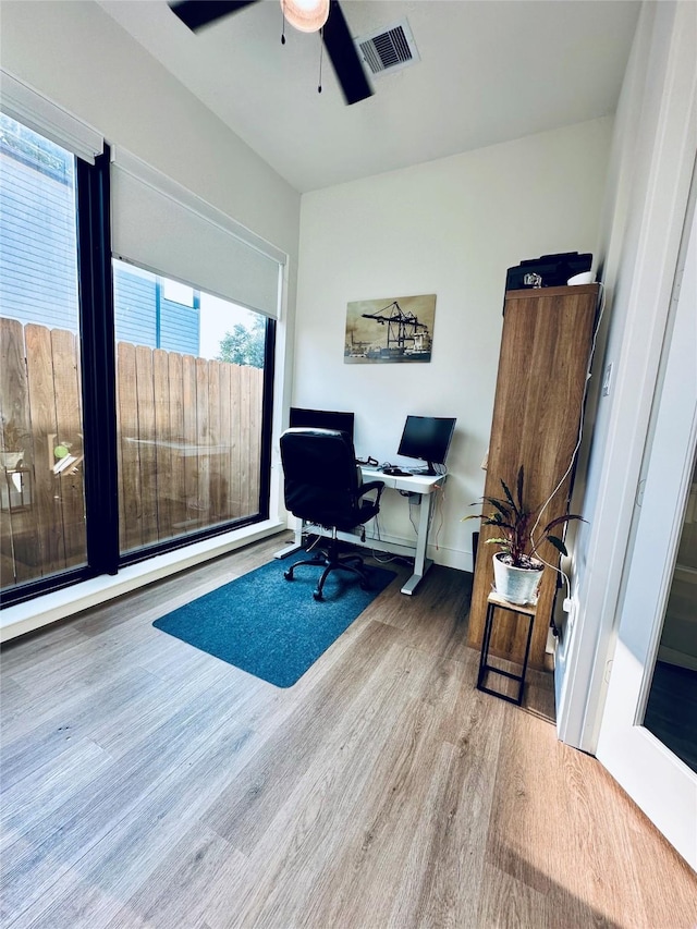 210 E 39th St, Houston, TX 77018 - home office featuring plenty of natural light, wood finished floors, ceiling fan, and baseboards