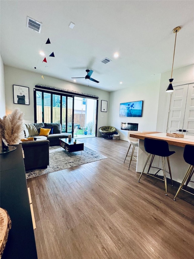 210 E 39th St, Houston, TX 77018 - living room with wood finished floors, recessed lighting, and ceiling fan