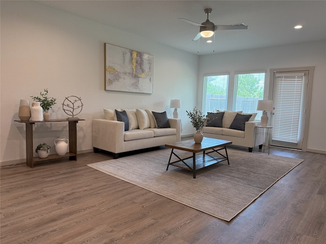 12545 Walmgate Ct, Houston, TX 77047 - living area featuring wood finished floors, a ceiling fan, baseboards, and recessed lighting