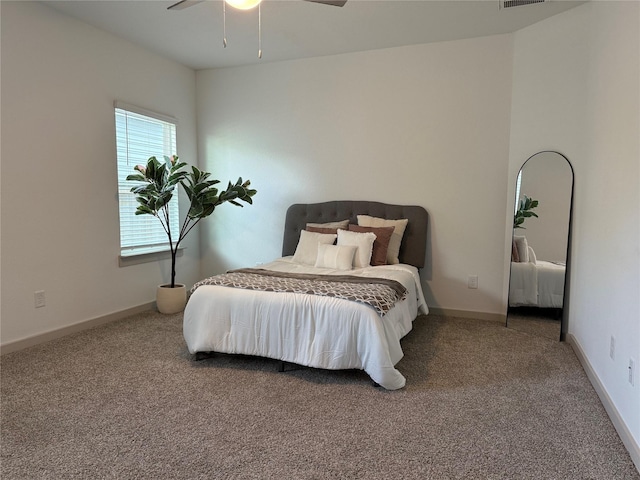 12545 Walmgate Ct, Houston, TX 77047 - carpeted bedroom with a ceiling fan and baseboards