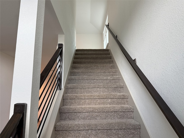 12545 Walmgate Ct, Houston, TX 77047 - stairway with a textured wall