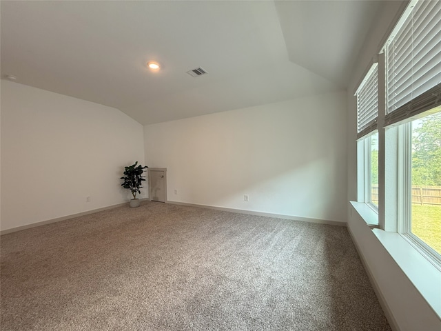 12545 Walmgate Ct, Houston, TX 77047 - carpeted empty room with lofted ceiling, healthy amount of natural light, and baseboards
