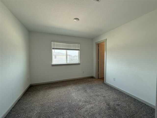 12545 Walmgate Ct, Houston, TX 77047 - carpeted empty room with baseboards