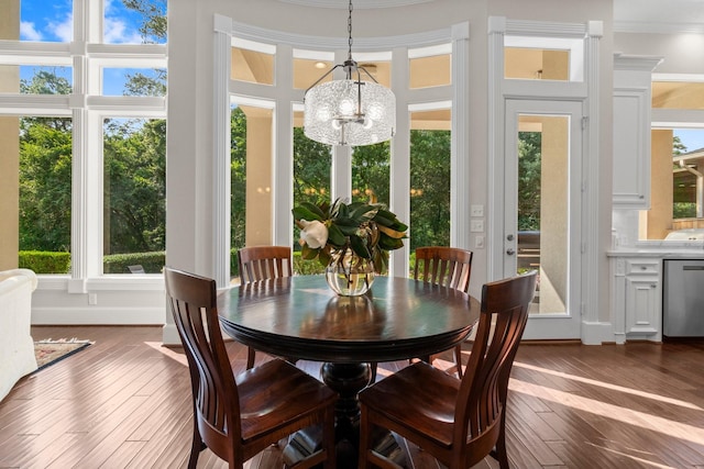 91 N Hunters Crossing Cir, The Woodlands, TX 77381 - dining area with a chandelier, dark wood-type flooring, baseboards, and crown molding