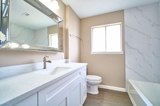 11706 Mclain Blvd, Houston, TX 77071 - bathroom featuring vanity, toilet, wood finished floors, and baseboards
