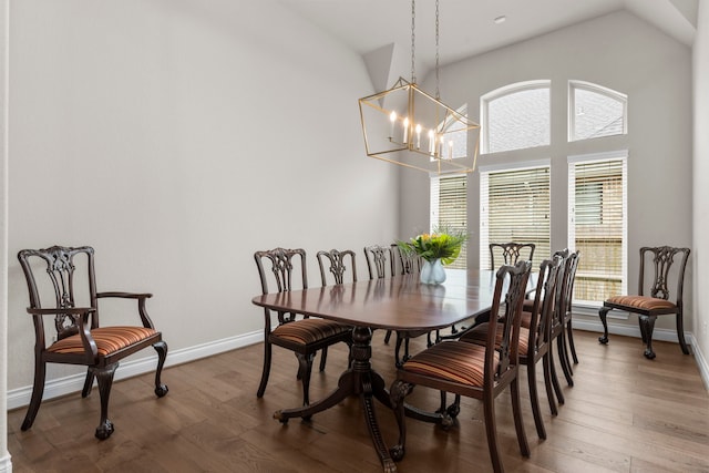 28911 Ally Lynn Way, Katy, TX 77494 - dining room with a chandelier, wood finished floors, baseboards, and high vaulted ceiling