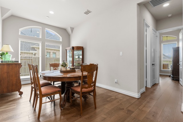 28911 Ally Lynn Way, Katy, TX 77494 - dining space featuring wood finished floors, baseboards, vaulted ceiling, and recessed lighting