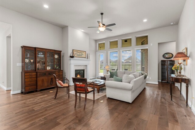 28911 Ally Lynn Way, Katy, TX 77494 - living room featuring a glass covered fireplace, ceiling fan, dark wood-style flooring, recessed lighting, and a towering ceiling