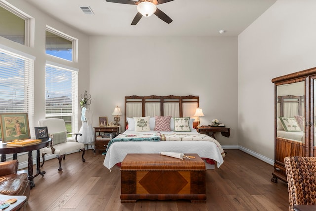 28911 Ally Lynn Way, Katy, TX 77494 - bedroom featuring wood finished floors, a ceiling fan, a high ceiling, and baseboards
