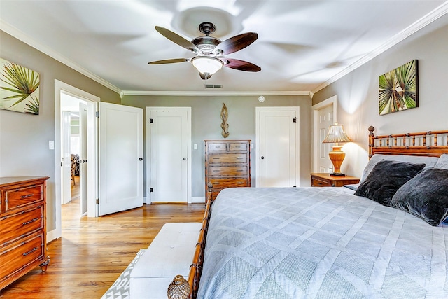 1200 E US Highway 90, Flatonia, TX 78941 - bedroom featuring wood finished floors, ornamental molding, and a ceiling fan