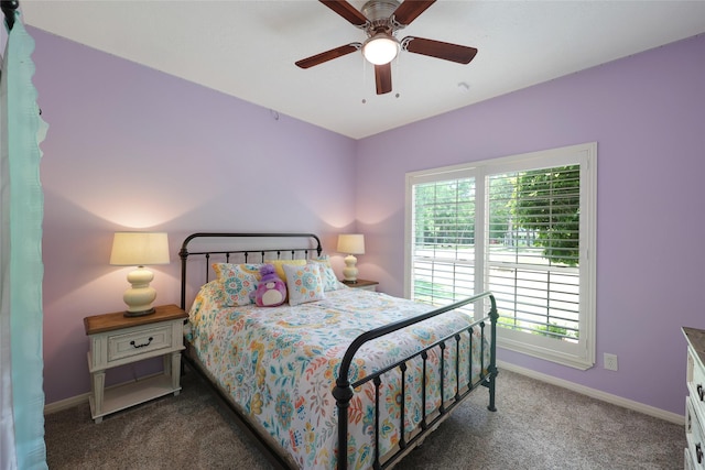 19202 Indigo Lake Dr, Magnolia, TX 77355 - carpeted bedroom with baseboards and ceiling fan