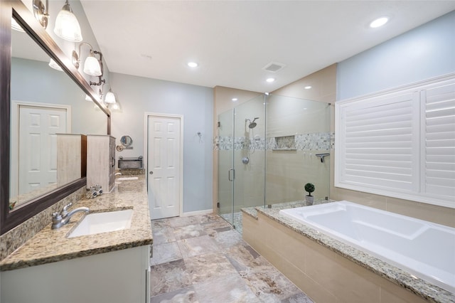 19202 Indigo Lake Dr, Magnolia, TX 77355 - bathroom with a garden tub, a shower stall, double vanity, baseboards, and recessed lighting
