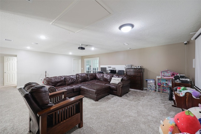 19202 Indigo Lake Dr, Magnolia, TX 77355 - living area featuring attic access, carpet flooring, and a textured ceiling