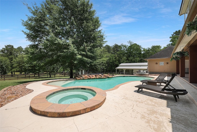 19202 Indigo Lake Dr, Magnolia, TX 77355 - view of pool with a patio, a pool with connected hot tub, and view of wooded area