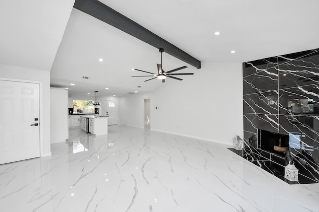22718 Carter Moir Ln, Katy, TX 77449 - unfurnished living room featuring light marble finish floors, recessed lighting, ceiling fan, and baseboards