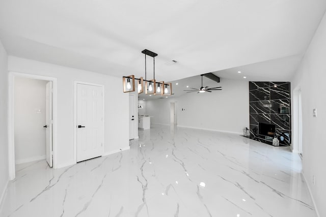 22718 Carter Moir Ln, Katy, TX 77449 - unfurnished dining area with baseboards, marble finish flooring, a ceiling fan, and lofted ceiling