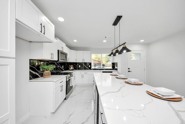 22718 Carter Moir Ln, Katy, TX 77449 - kitchen with stainless steel appliances, backsplash, white cabinets, recessed lighting, and light stone counters