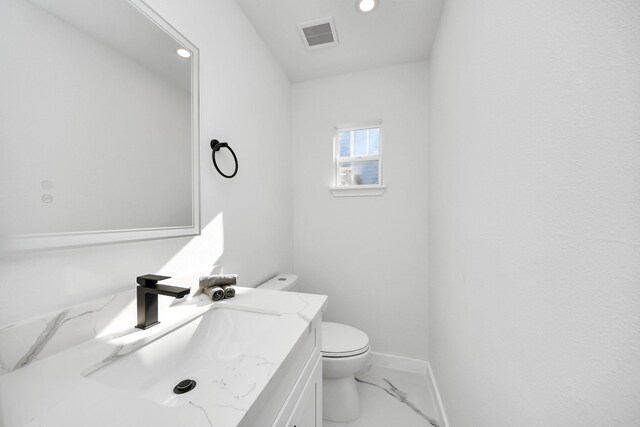 22718 Carter Moir Ln, Katy, TX 77449 - bathroom with toilet, vanity, baseboards, recessed lighting, and marble finish floors