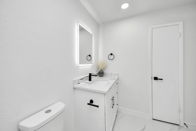 22718 Carter Moir Ln, Katy, TX 77449 - half bathroom with vanity, toilet, and baseboards
