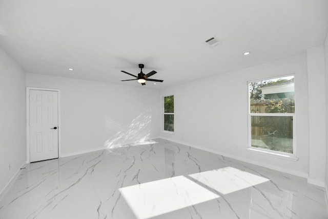 22718 Carter Moir Ln, Katy, TX 77449 - unfurnished room featuring baseboards, marble finish flooring, plenty of natural light, recessed lighting, and a ceiling fan