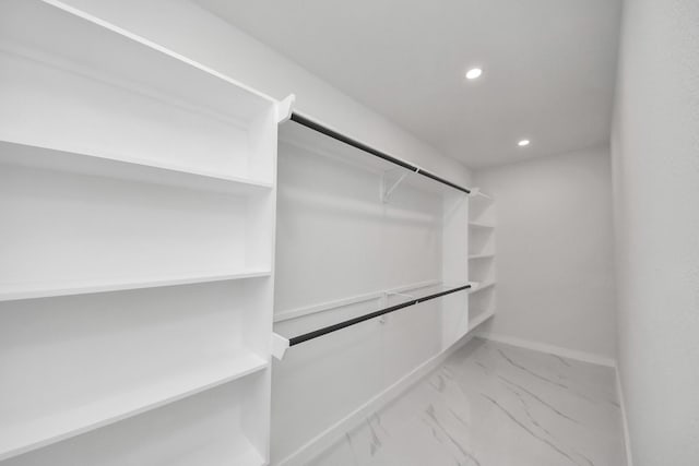 22718 Carter Moir Ln, Katy, TX 77449 - walk in closet featuring marble finish flooring