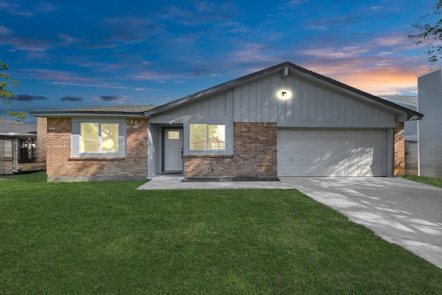 22718 Carter Moir Ln, Katy, TX 77449 - ranch-style home with a garage, brick siding, driveway, and a lawn