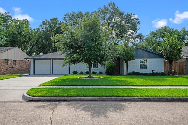 3010 Helberg Rd, Houston, TX 77092 - view of front of house featuring brick siding, concrete driveway, and an attached garage