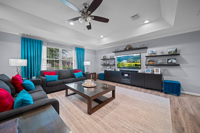 3010 Helberg Rd, Houston, TX 77092 - living room with a ceiling fan, a tray ceiling, light wood-type flooring, recessed lighting, and baseboards