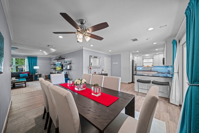 3010 Helberg Rd, Houston, TX 77092 - dining room with ornamental molding, recessed lighting, light wood-style floors, and a ceiling fan