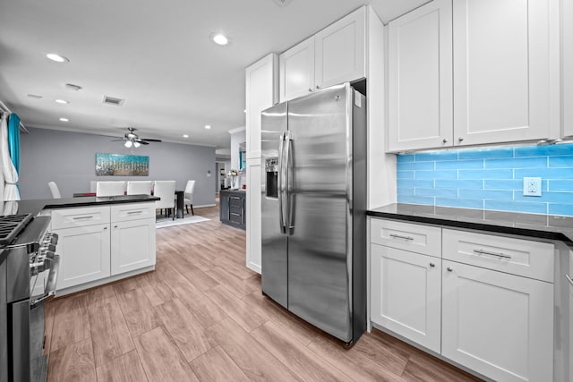 3010 Helberg Rd, Houston, TX 77092 - kitchen with appliances with stainless steel finishes, dark countertops, white cabinetry, a ceiling fan, and recessed lighting