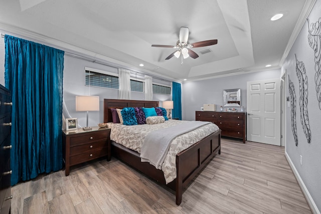 3010 Helberg Rd, Houston, TX 77092 - bedroom featuring a tray ceiling, wood finished floors, recessed lighting, ceiling fan, and baseboards