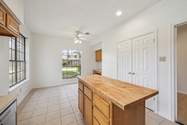 14507 Sycamore Lake Rd, Houston, TX 77062 - kitchen with wood counters, light tile patterned flooring, a ceiling fan, brown cabinets, and recessed lighting