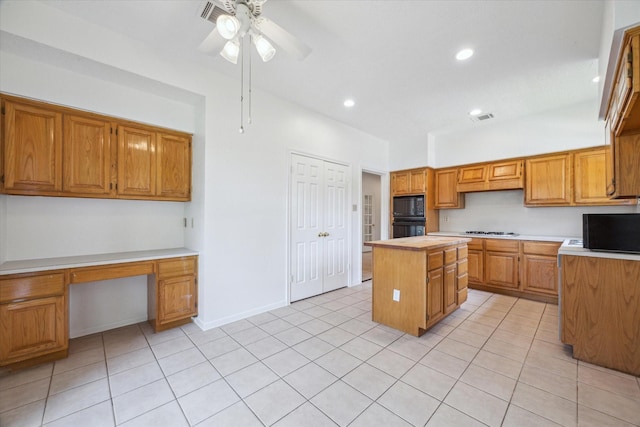 14507 Sycamore Lake Rd, Houston, TX 77062 - kitchen with black appliances, a center island, light countertops, a ceiling fan, and light tile patterned floors