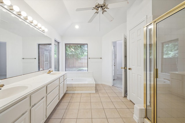 14507 Sycamore Lake Rd, Houston, TX 77062 - bathroom featuring vaulted ceiling, a garden tub, double vanity, a stall shower, and tile patterned flooring