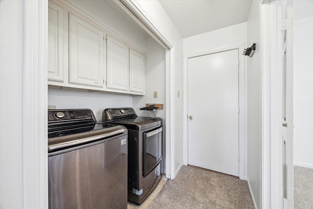 14507 Sycamore Lake Rd, Houston, TX 77062 - laundry area with cabinet space, washer and dryer, baseboards, and light colored carpet