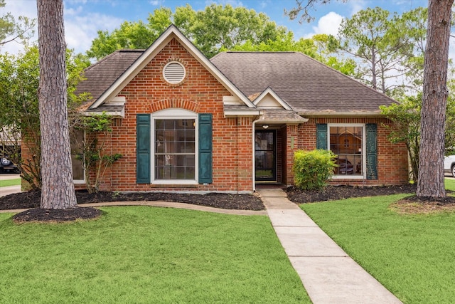14507 Sycamore Lake Rd, Houston, TX 77062 - view of front of house with a shingled roof, brick siding, and a front lawn